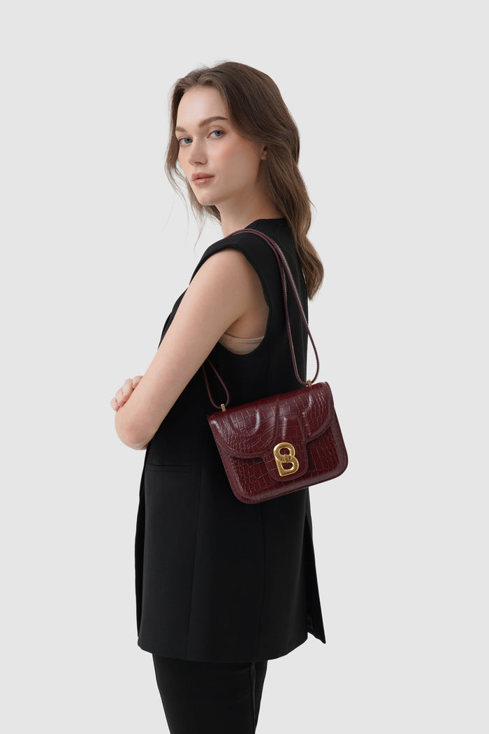 alba bag croco in burgundy by buttonscarves worn as shoulder bag