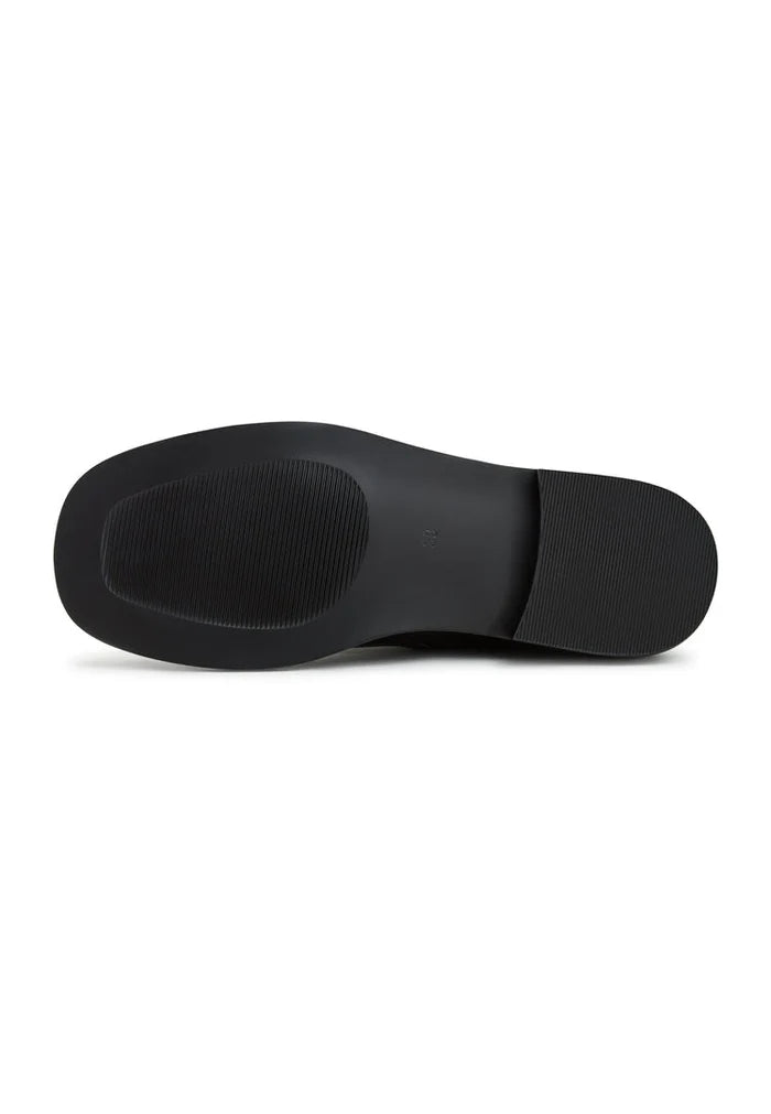 A pair of stylish motorcycle boots made of waterproof leather, perfect for the biker enthusiast.