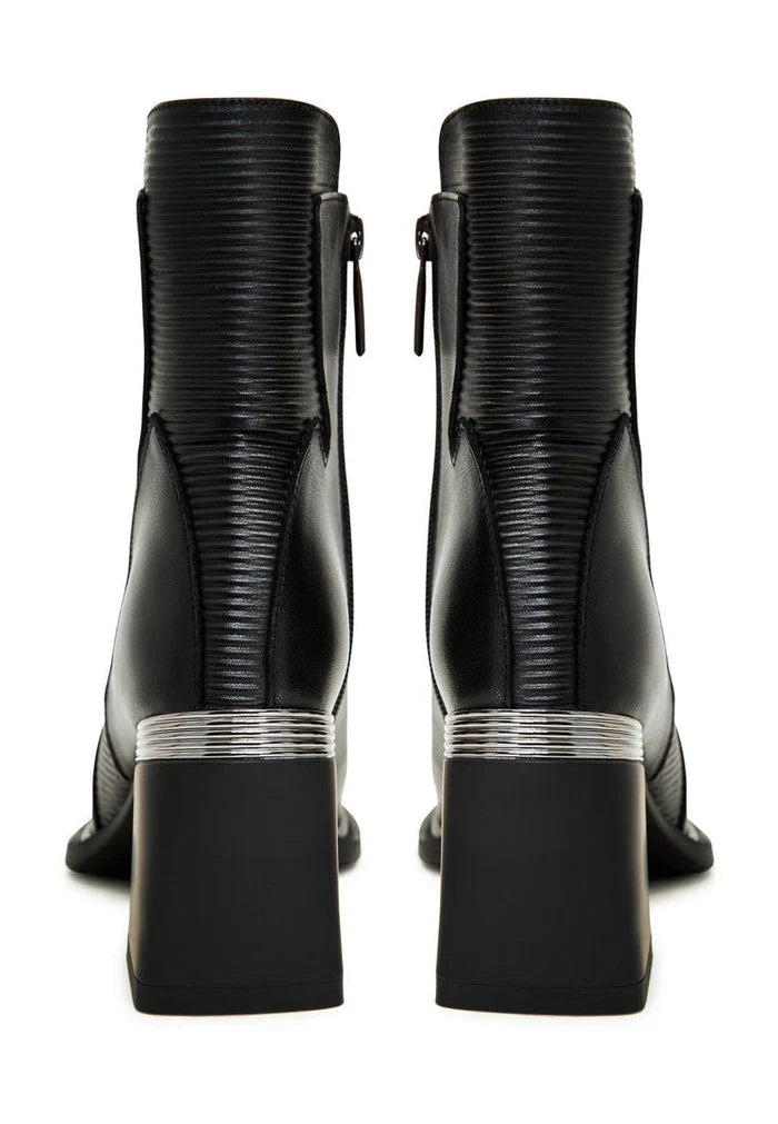 A stylish pair of black block heel ankle boots, perfect for any outfit.