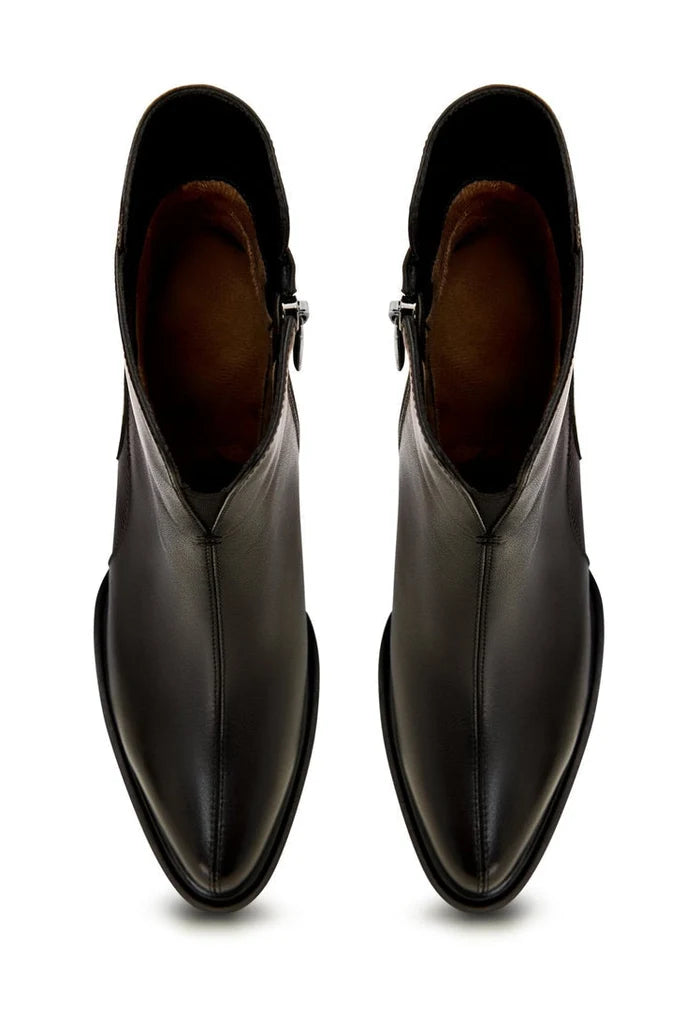 A stylish pair of black block heel ankle boots that add a chic touch to any outfit.