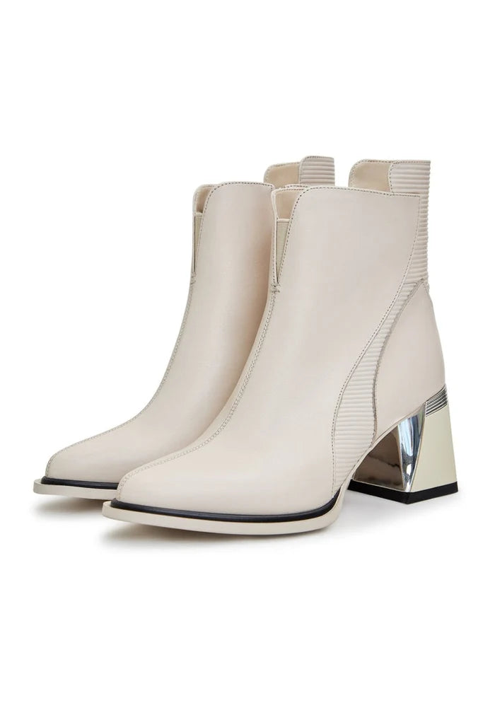 A stylish pair of off white block heel ankle boots for women, featuring a chunky heel and trendy fashion design.