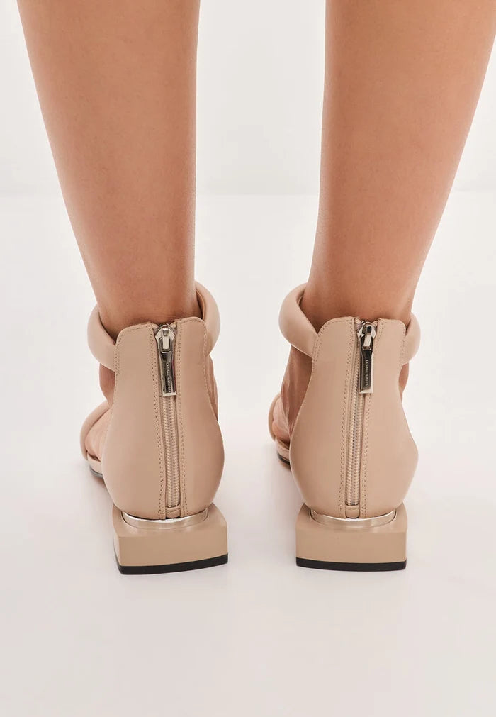 A stylish pair of beige block heel sandals named Sofia, perfect for any summer outfit.