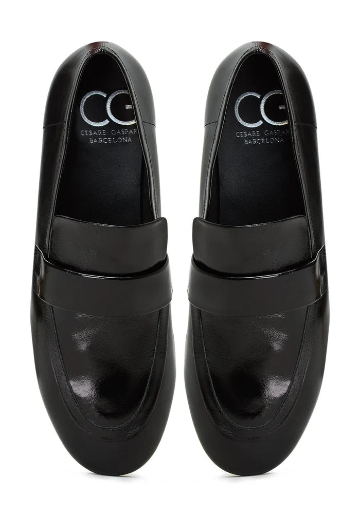 A stylish pair of black Diana block heeled loafers, perfect for women's fall fashion shoes.