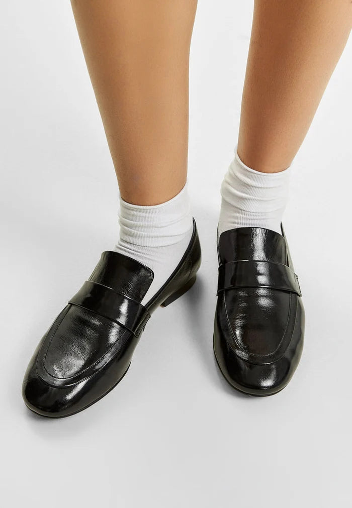 A stylish pair of black block heeled Diana loafers, perfect for fall fashion, for women.