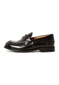 A stylish pair of women's black leather loafers with a block heel, known as the Dinara black shoes.