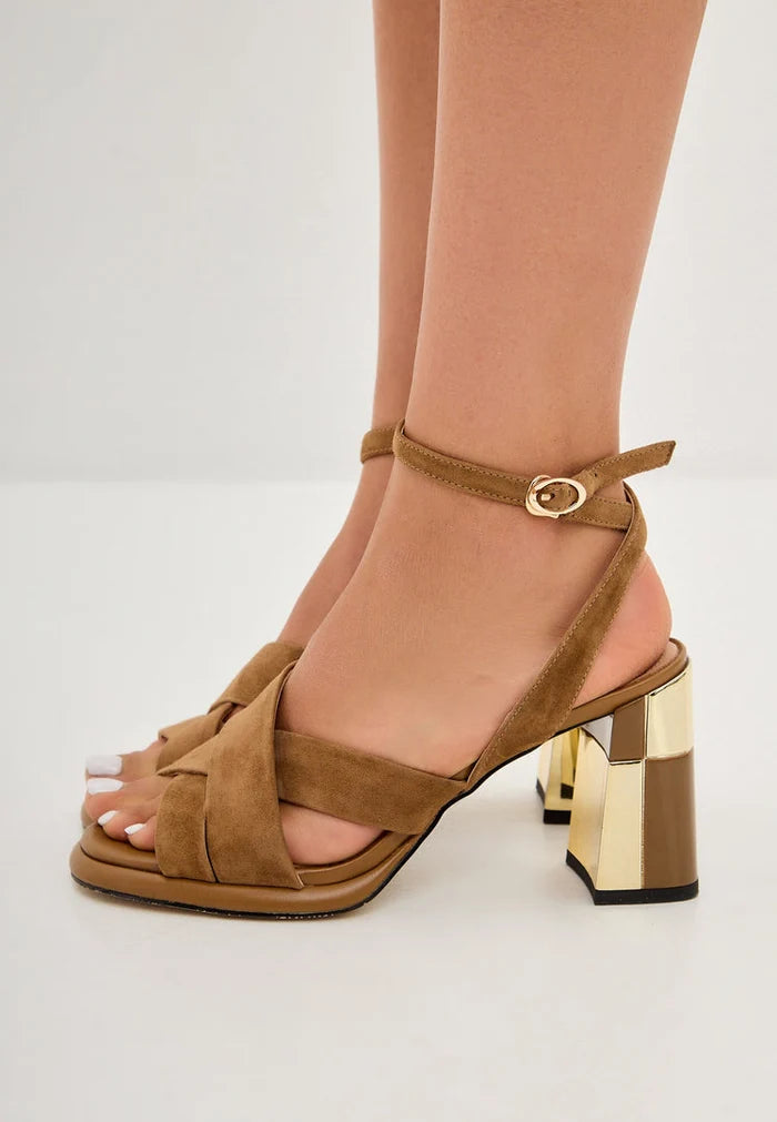 A pair of chic beige block heeled sandals for women, perfect for adding a fashionable touch to any outfit.