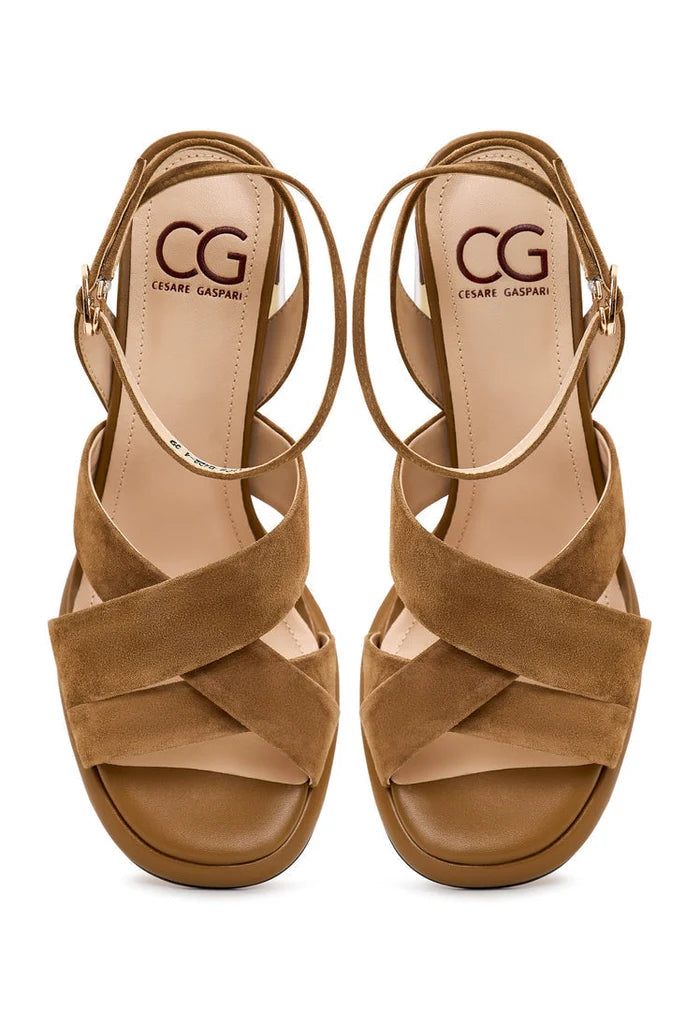 A pair of fashionable women's block heeled beige sandals, known as the Evelyn sandals.
