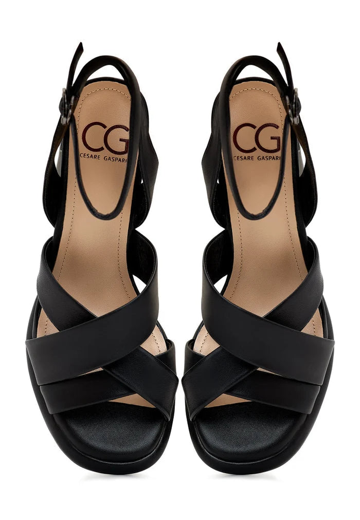 A stylish pair of black block-heeled sandals, the Evelyn black block heels perfect for a versatile day-to-night look.