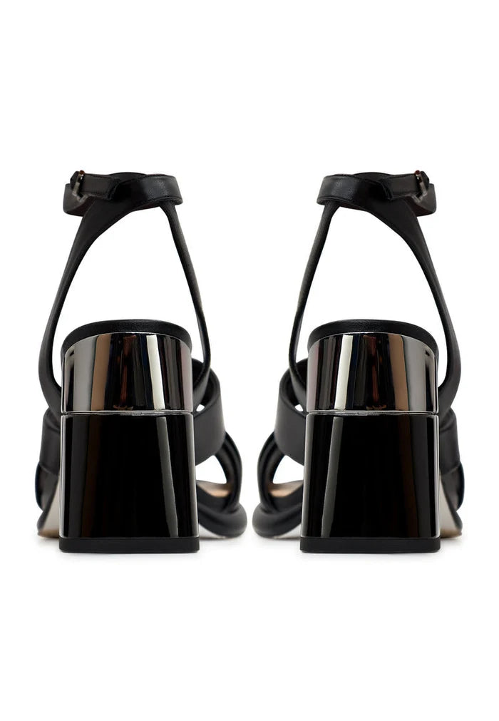 A stylish pair of black block heeled sandals known as Evelyn, perfect for any outfit or occasion.