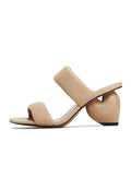 A pair of stylish beige block heeled Isla sandals, perfect for women's summer footwear.
