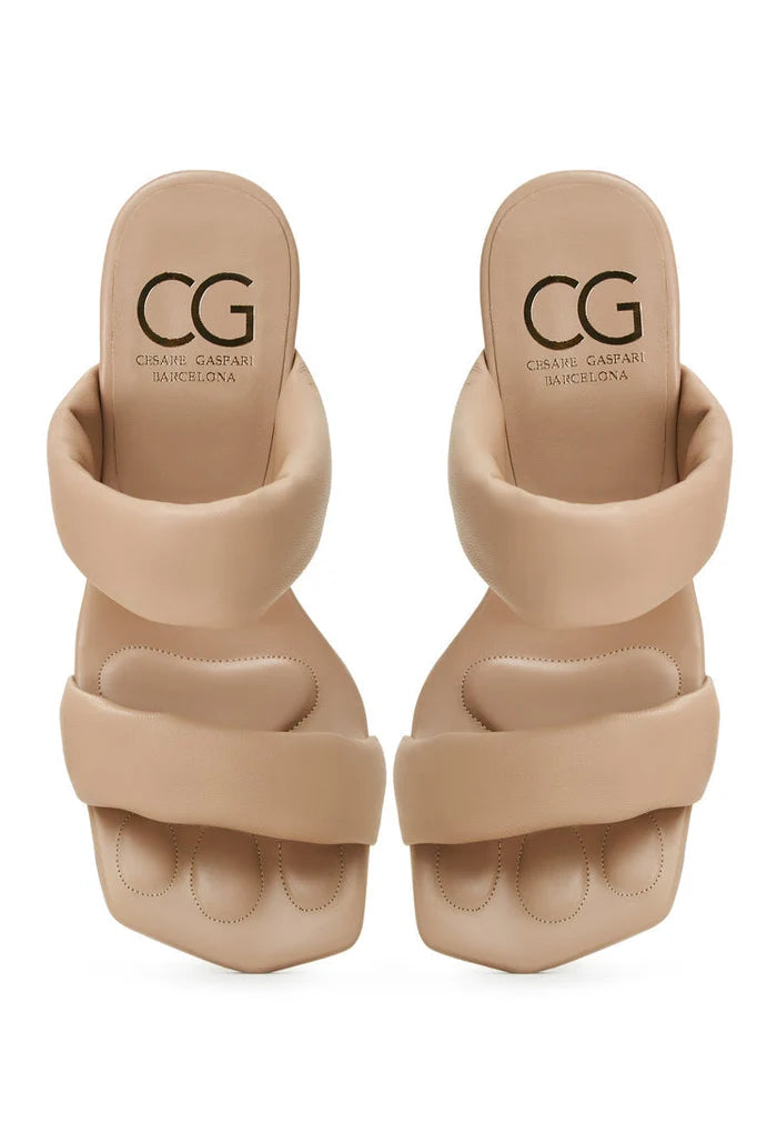 A pair of stylish women's Isla block heeled beige sandals, perfect for summer footwear fashion.