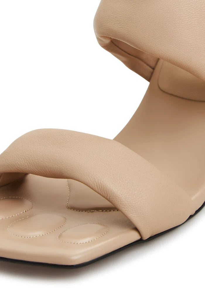 A pair of stylish Isla block heeled beige sandals for women - perfect summer footwear.