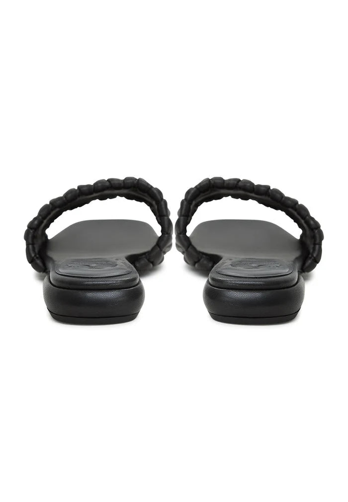 A stylish pair of black block heeled slippers from the Stephanie brand, perfect for women looking for comfort and style in their footwear.