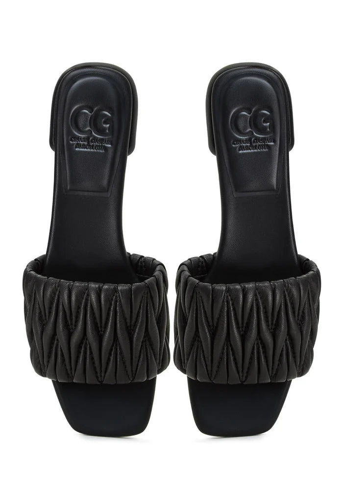 A stylish pair of black block heeled slippers from the Stephanie brand, perfect for any woman seeking both comfort and elegance.