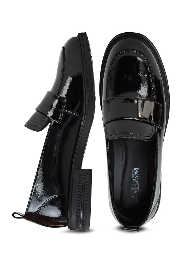 A stylish pair of black block heel loafers for women - perfect combination of fashion and comfort.