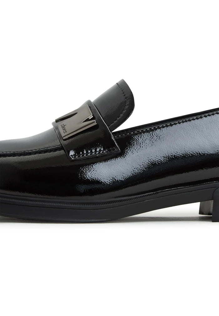 A stylish pair of black block heel loafers for women, a perfect combination of fashion and comfort.