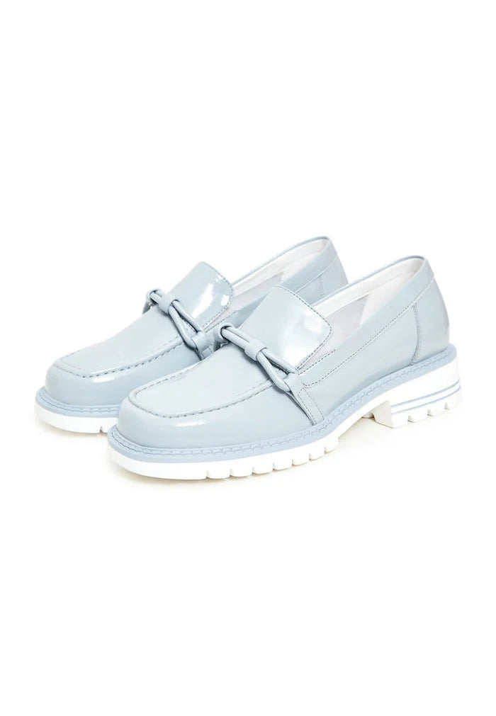 A stylish pair of women's fashion loafers in a beautiful shade of blue, featuring block heels for a trendy look.