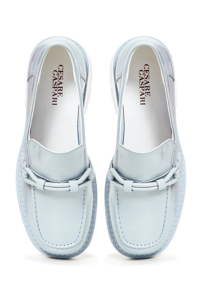 A fashionable pair of women's blue block heels loafers, perfect for any stylish outfit.