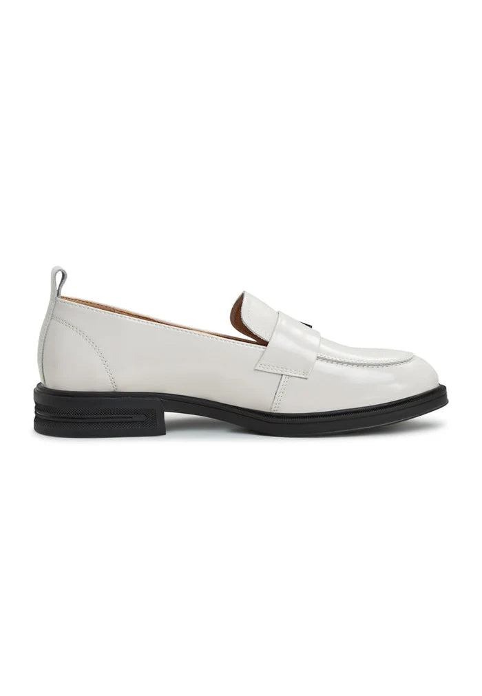 A stylish pair of white block heel loafers for women, the perfect blend of fashion and comfort.