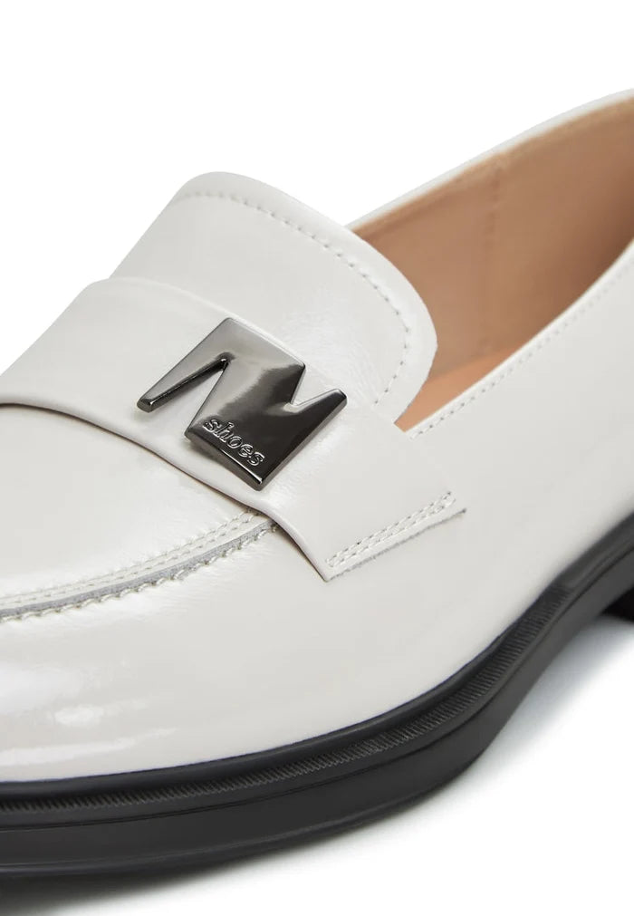 A stylish pair of women's white block heel loafers, perfect for a fashionable look.