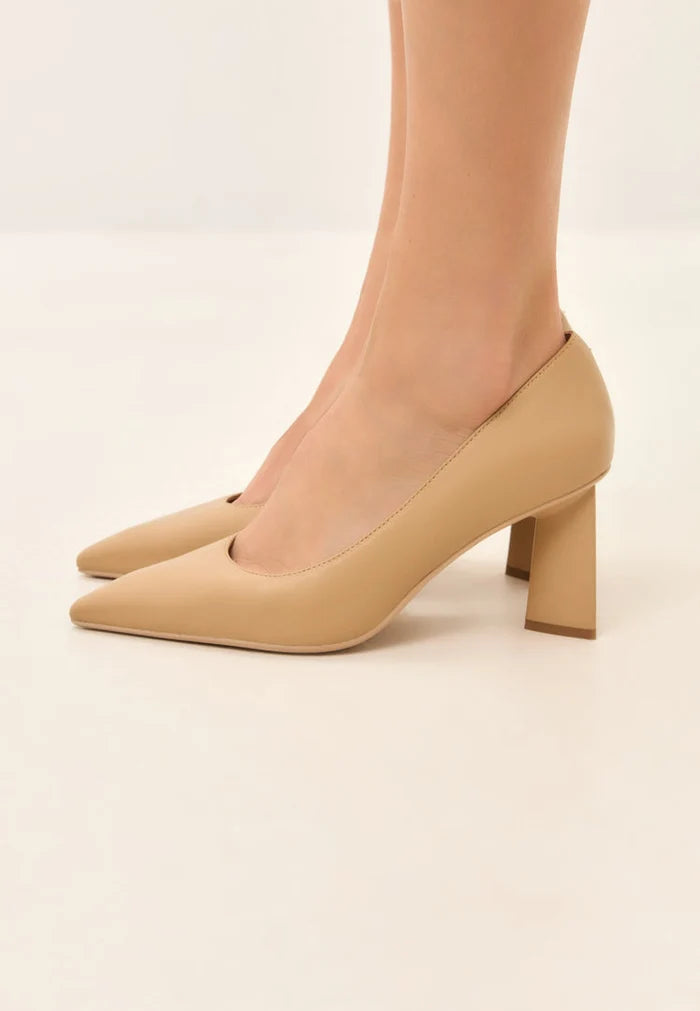 A pair of trendy beige block heel pumps known as Silvia beige pumps, perfect for women's fashion.