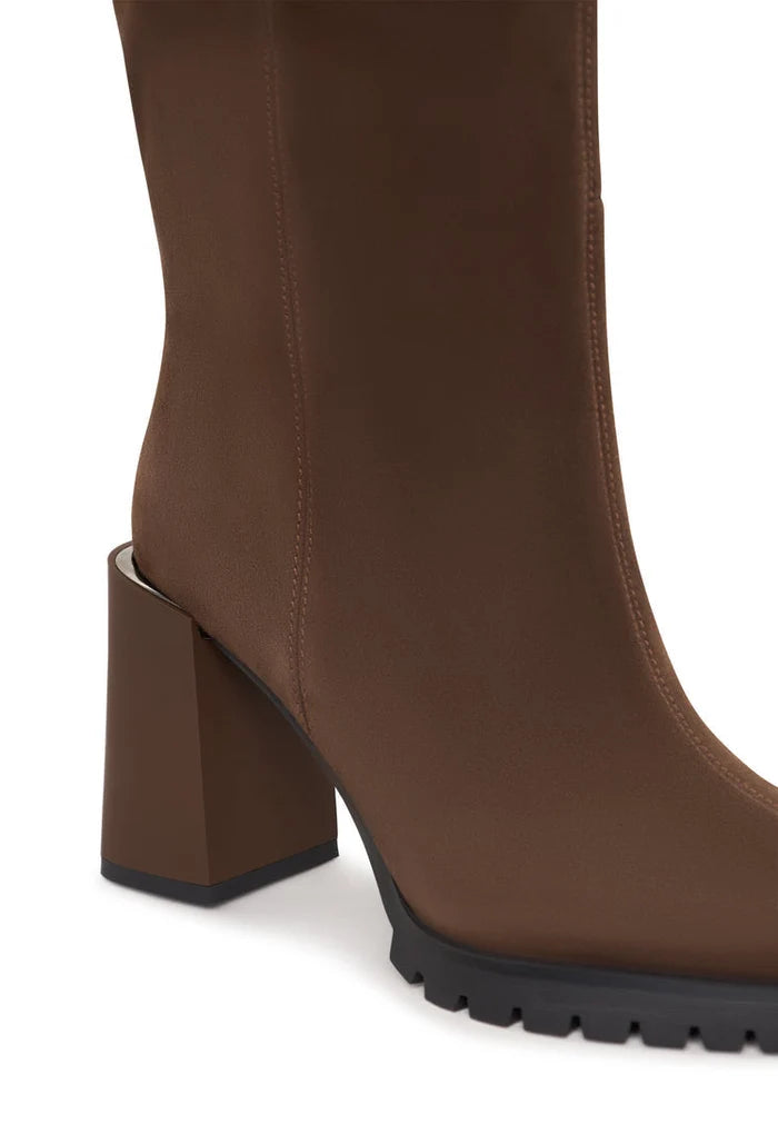 A stylish pair of knee-high block heel Nala boots in a bold brown color, perfect for women's fashion footwear.