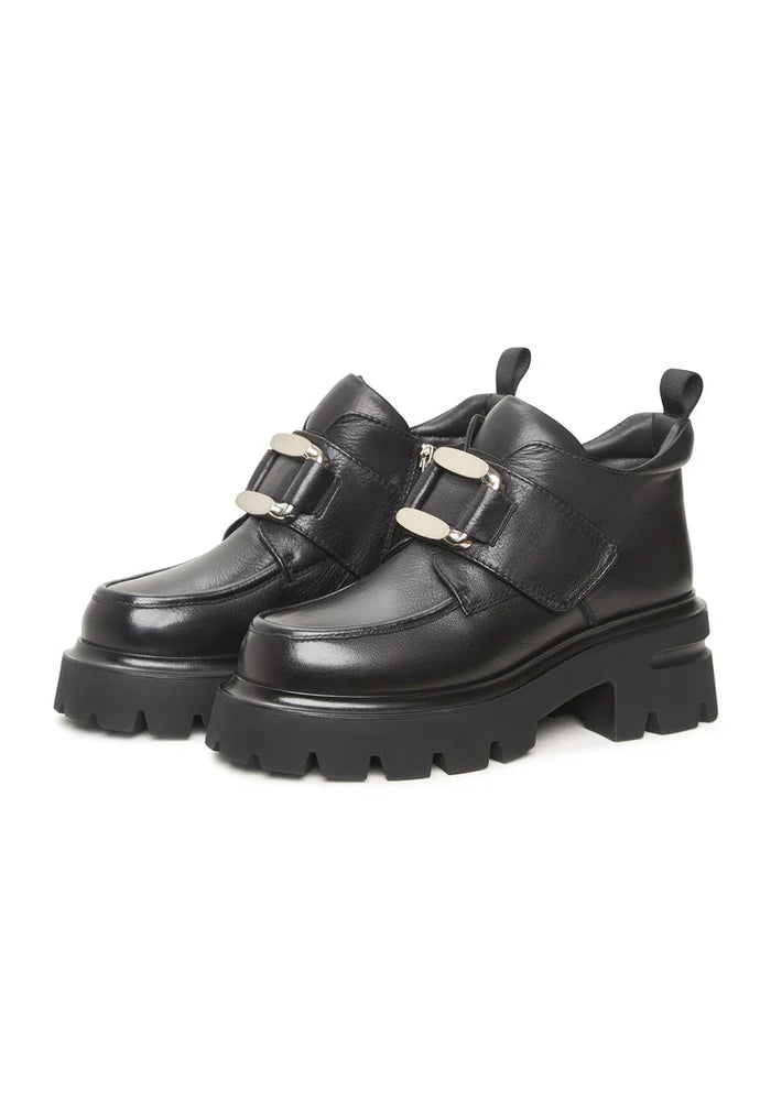 A sleek pair of black leather double buckle loafers from Geirr, a bold choice in men's fashion footwear.
