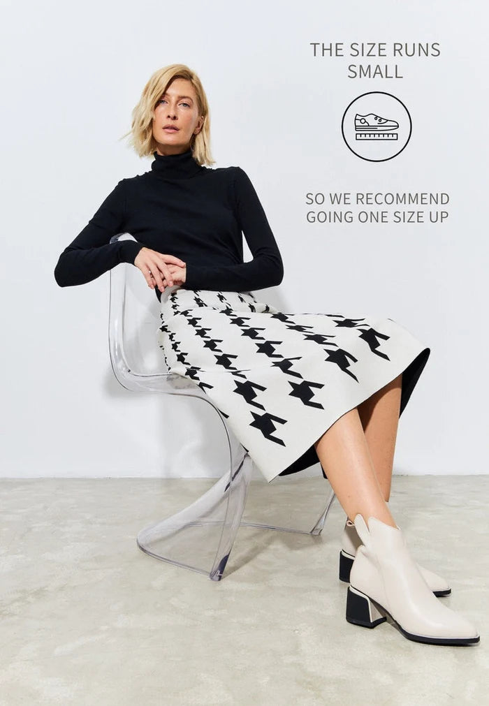 A pair of stylish beige ankle boots for women, perfect for a casual and comfortable fashion statement.
