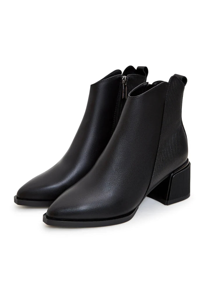 A stylish pair of affordable black suede ankle boots for women, perfect for casual wear.