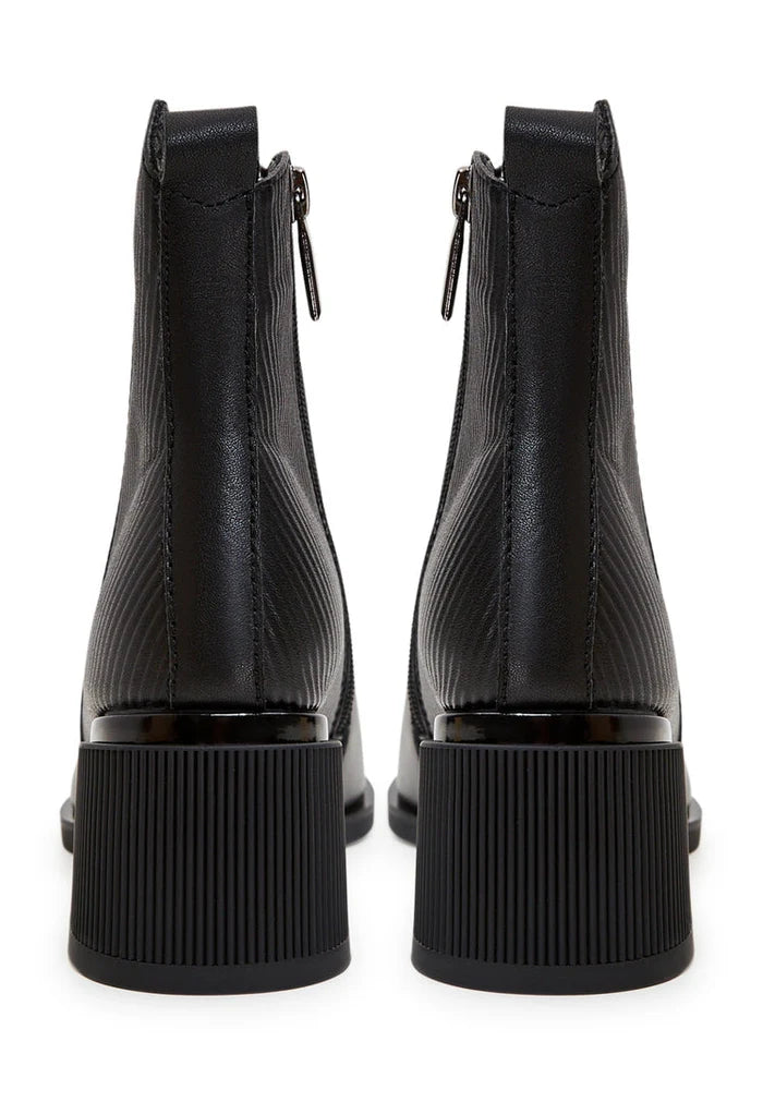A pair of stylish and affordable women's black suede ankle boots, perfect for casual wear.