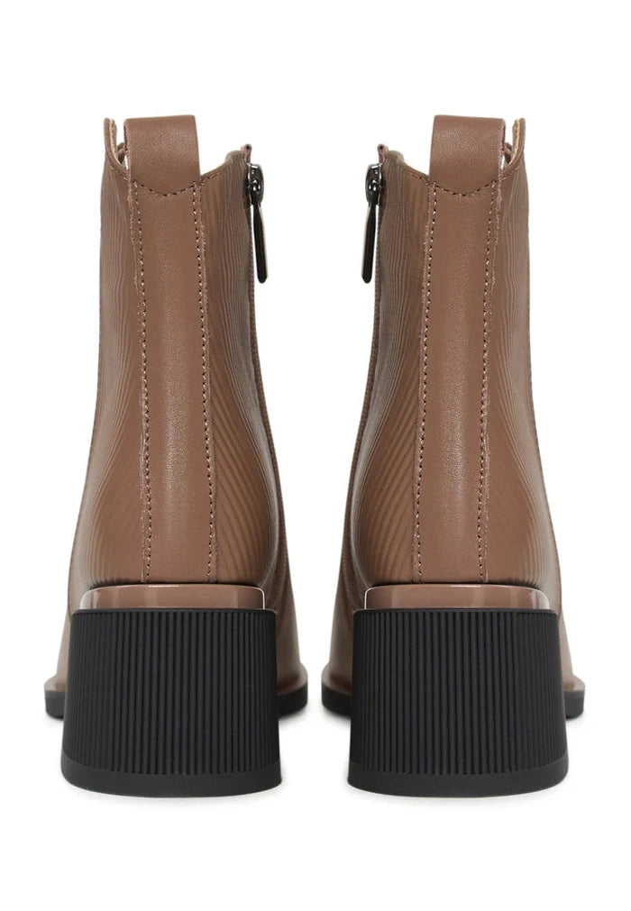 A pair of stylish brown leather women's ankle boots, perfect for a casual and chic look.