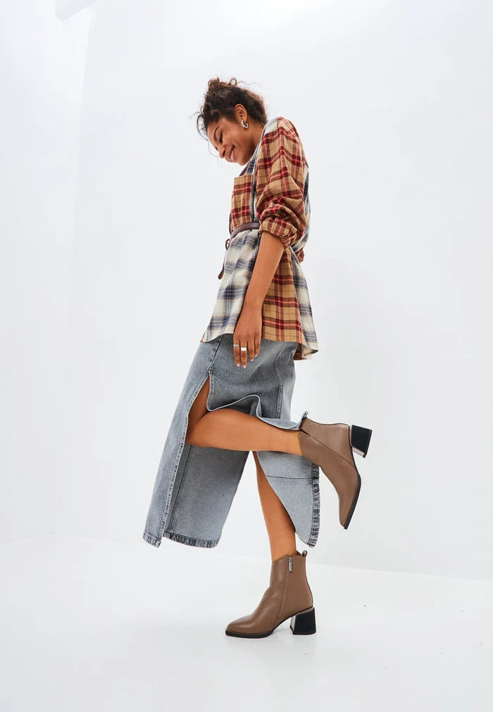 A pair of stylish brown leather women's ankle boots, perfect for a casual yet fashionable look.