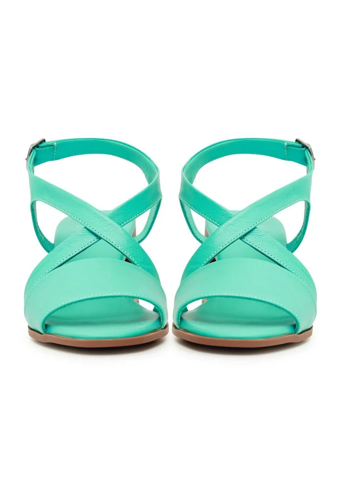 A stylish pair of casual green block heel sandals, perfect for any occasion.