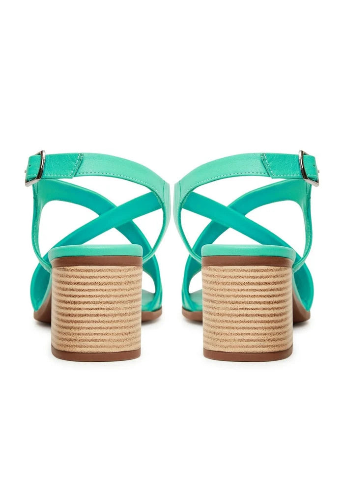 A stylish pair of green block heel sandals, perfect for adding a pop of color to your casual outfit.