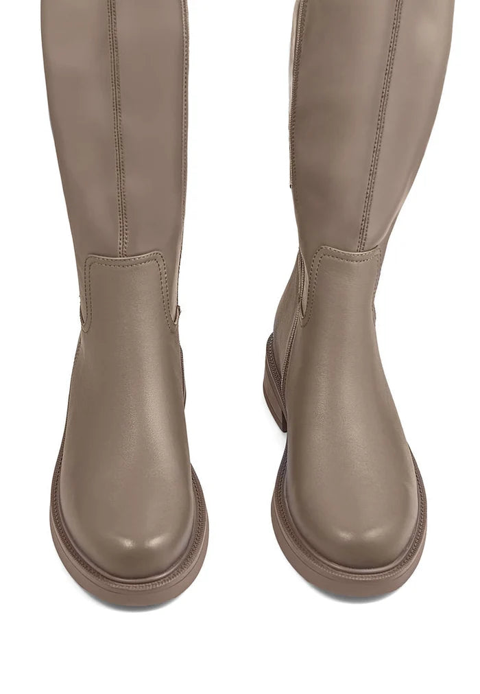 A pair of trendy beige ankle boots with block heels, perfect for women's fashion outfits.