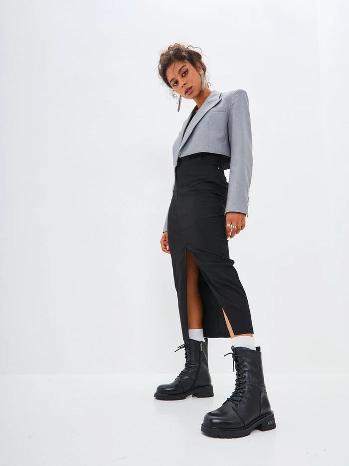 A stylish pair of black leather ankle boots with a block heel, perfect for casual wear.