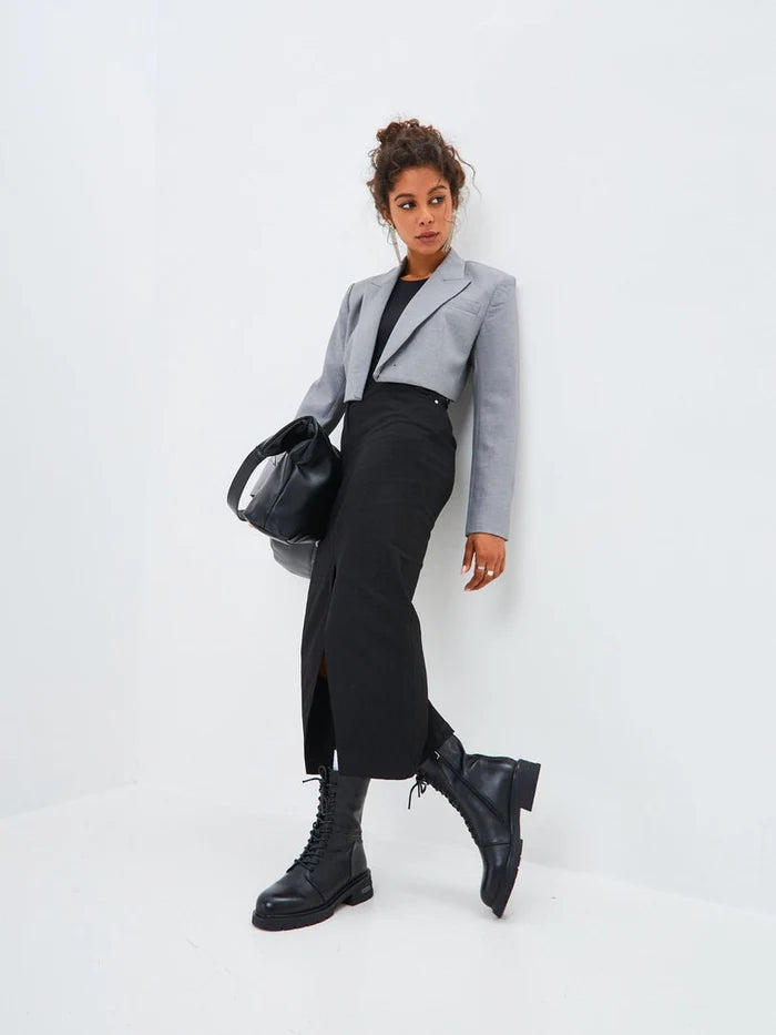 A pair of chic black leather ankle boots with a block heel, perfect for casual outings.
