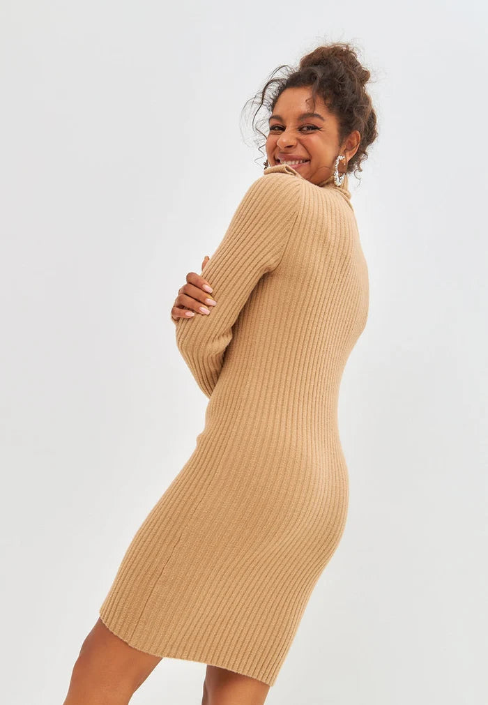 A trendy beige knitted dress from CG clothing, perfect for women's fashion.