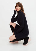 A fashionable black knitted dress from CG clothing, perfect for women seeking chic knitwear fashion with a designer touch.