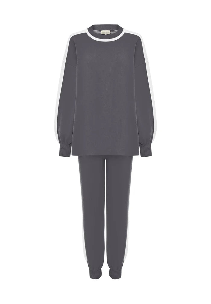 A cozy and stylish grey knitted jogger set, perfect for relaxing at home or running errands in comfort.