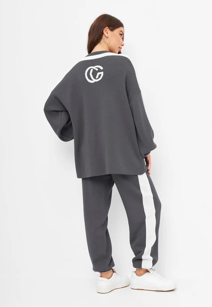 A stylish and cozy grey knitted jogger set, perfect for a comfortable lounge outfit or casual day at home.