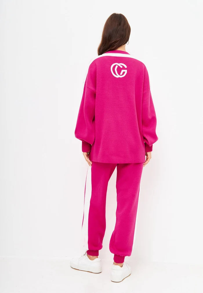 A cozy and stylish pink knitted jogger set for women, perfect for a casual knitwear outfit, also known as a CG pink co-ord set.