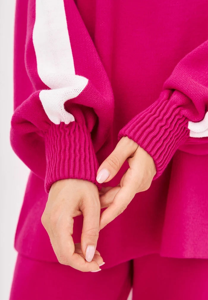 A stylish pink knitted jogger set for women, a perfect casual knitwear outfit for any occasion.