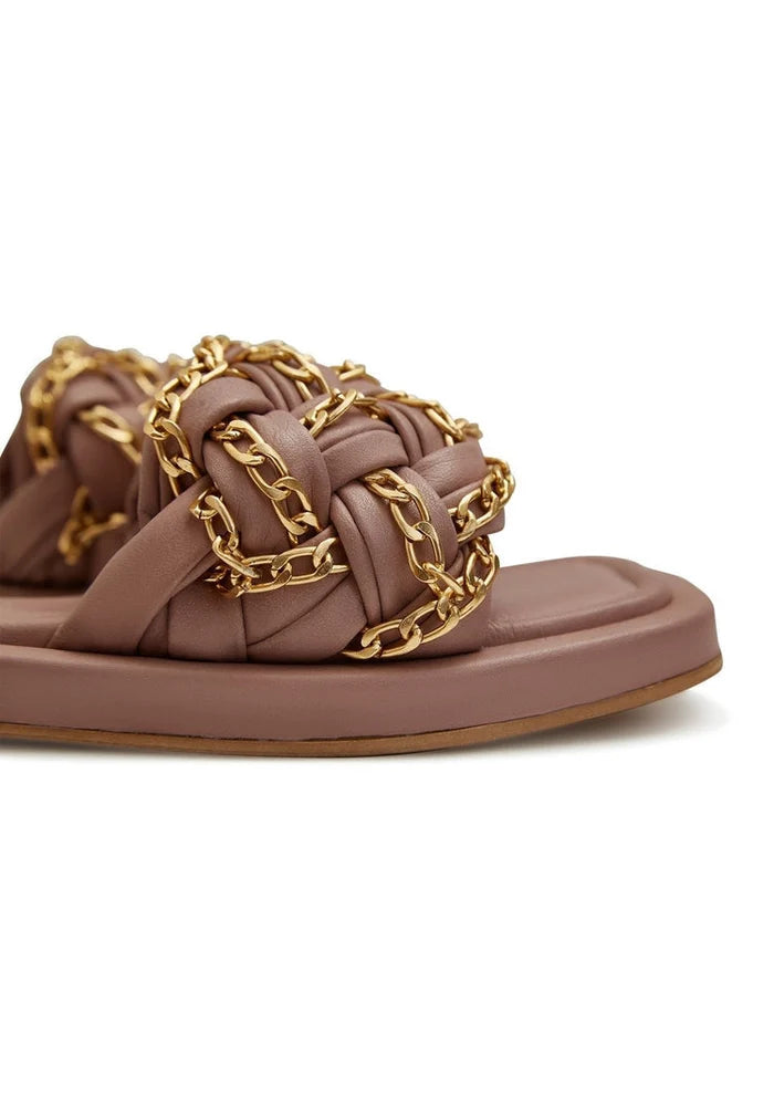 A pair of stylish beige chain leather sandals for women, perfect for adding a chic touch to any outfit.