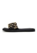 A close-up image of black leather chain sandals for women, perfect for the summer with a stylish chain detail design.