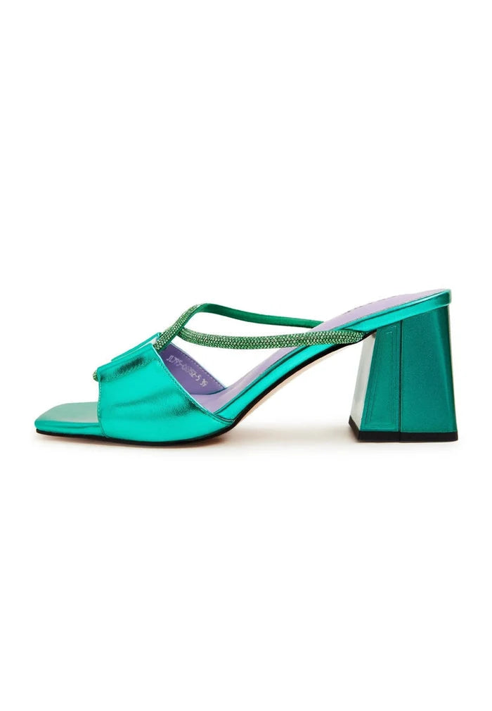 A sophisticated pair of green backless heels - the perfect chic and stylish choice for any outfit.