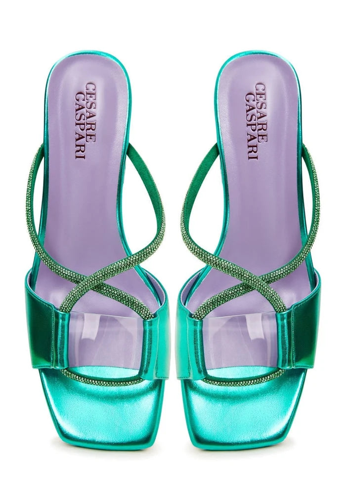 A pair of chic green backless heels with a unique design, perfect for making a fashion statement - the Rosalia heels.
