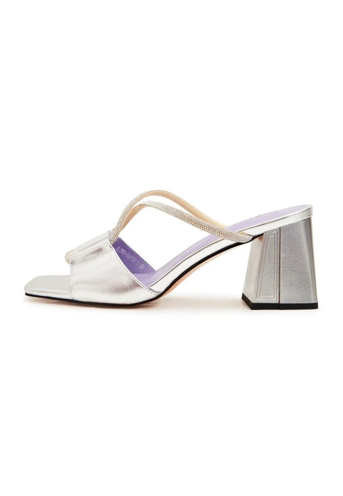A pair of elegant silver Rosalia backless high heel sandals, the epitome of chic footwear.