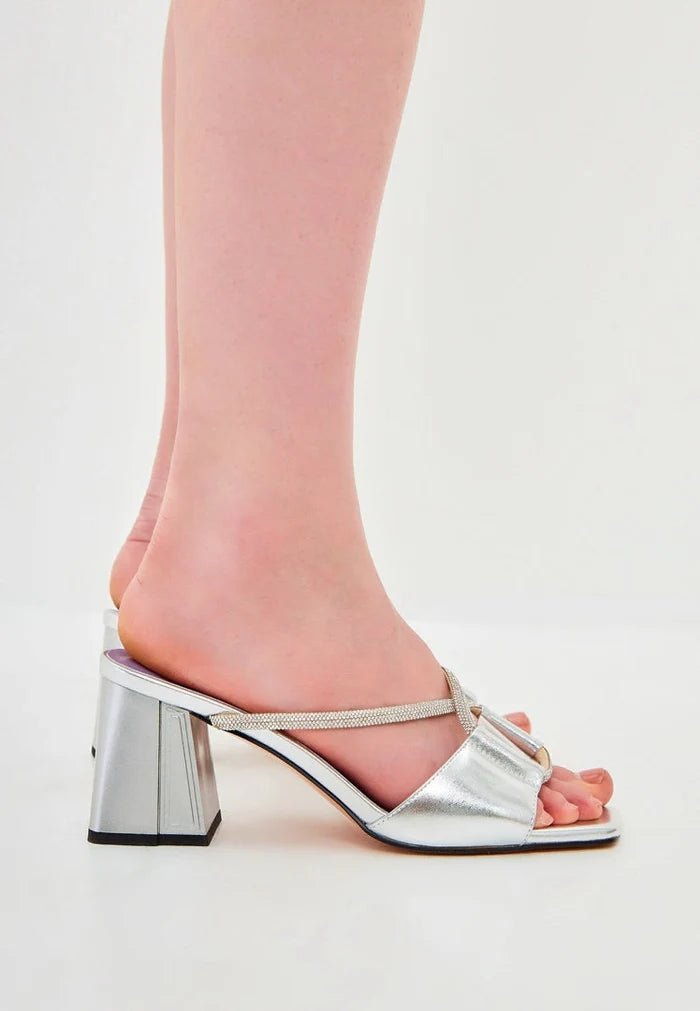 A stylish pair of chic silver backless high heel sandals, perfect for any occasion like the Rosalia heels.