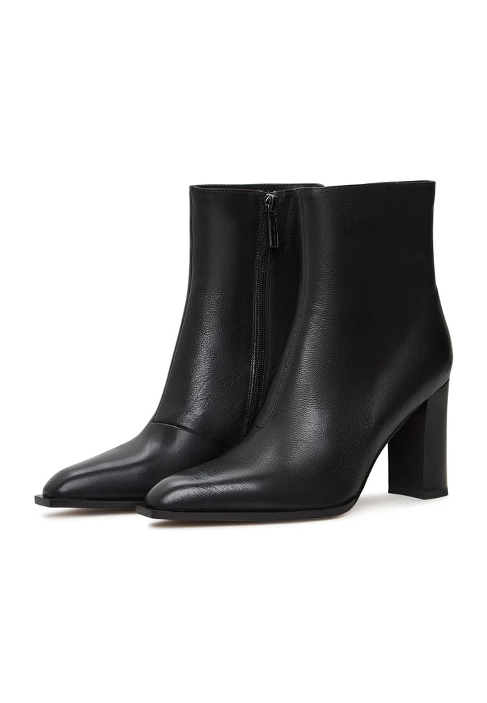 A stylish pair of women's black boots with a chic block heel design, known as Athena black boots, perfect for any fashionable outfit.
